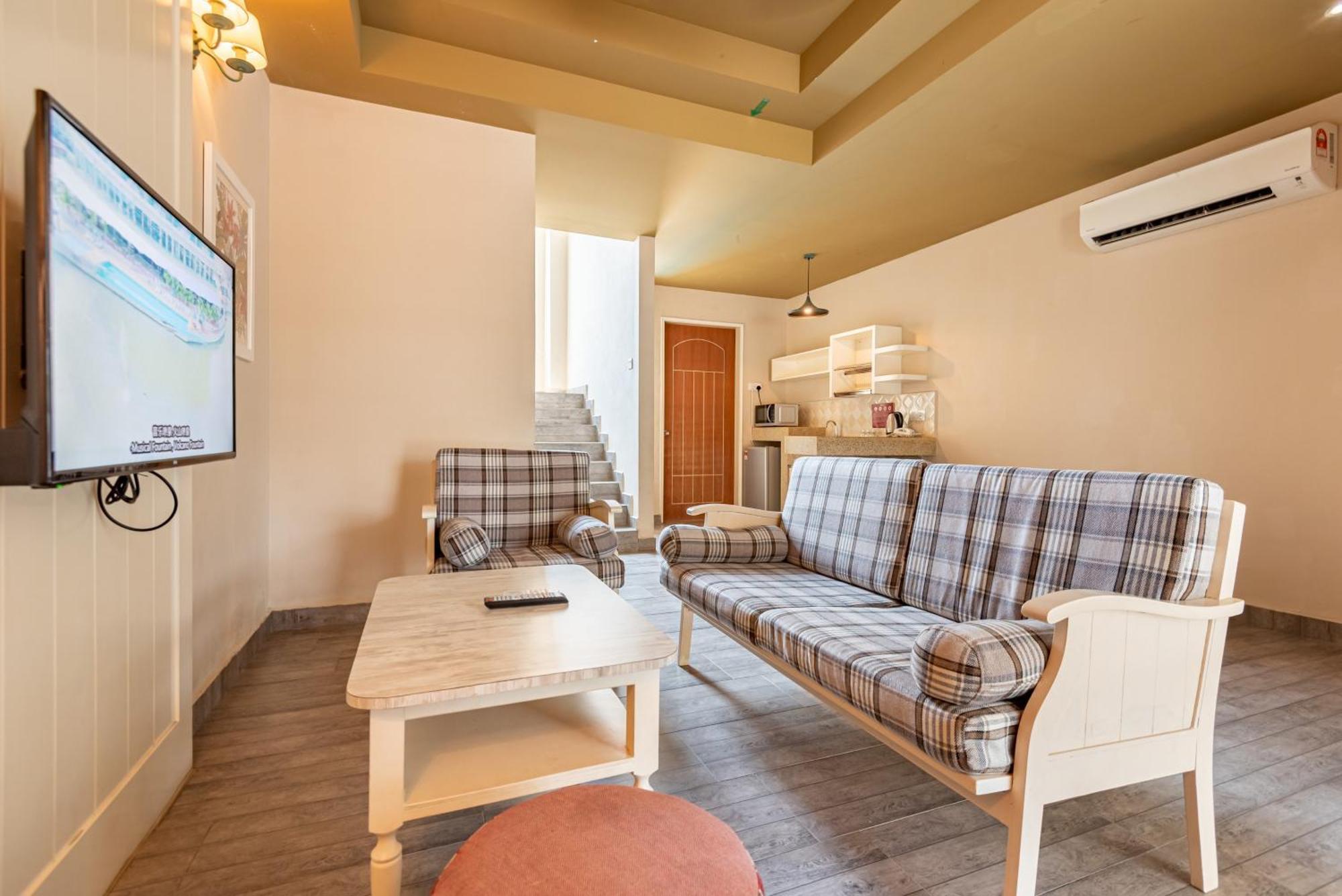 ตาซิก์ วิลลา อินเตอร์เนชั่นแนล รีสอร์ต Hotel พอร์ตดิ๊กสัน ภายนอก รูปภาพ A living room in a serviced apartment in Beijing, China