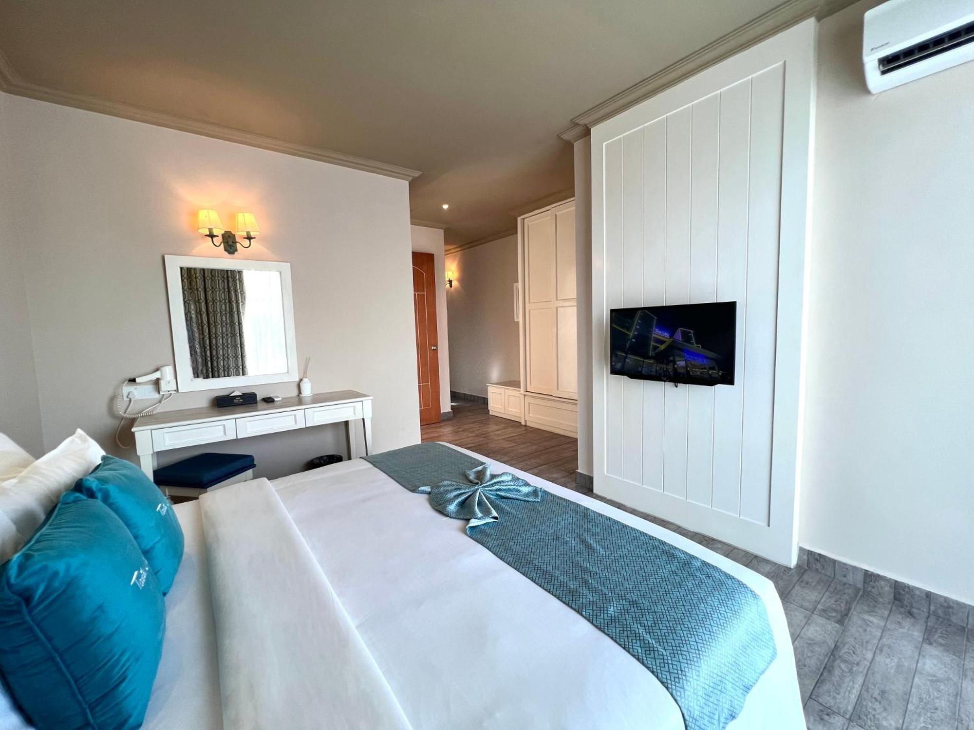 ตาซิก์ วิลลา อินเตอร์เนชั่นแนล รีสอร์ต Hotel พอร์ตดิ๊กสัน ภายนอก รูปภาพ A bedroom at the hotel